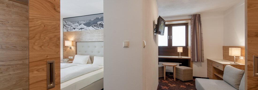 Schlafzimmer mit Wohnbereich - Haus Heiners - Sölden