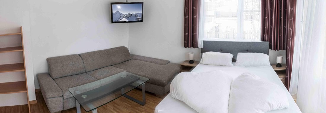 großes Zimmer mit Schlafsofa - Landhaus Martinus - Sölden